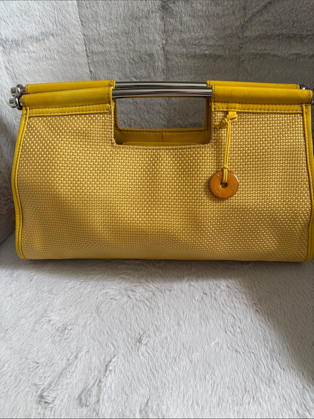 The Sak Yellow Woven Shoulder Bag with Metal Handle
